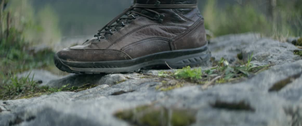 Someone is standing on a rock