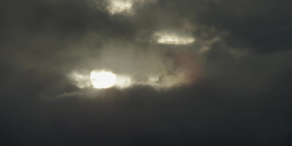 The sun behind clouds