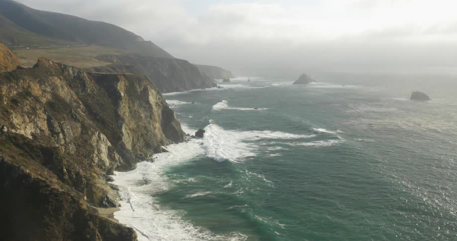 Waves crashing on a rocky cliff side