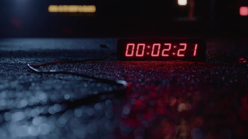 Digital timer counting down with a wire coming from it