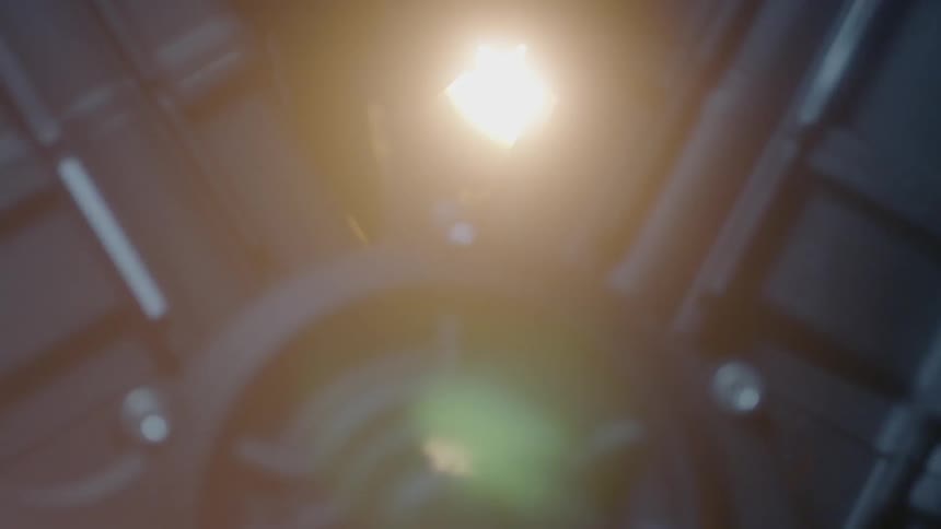 A light illuminates the metal on a motorcycle engine