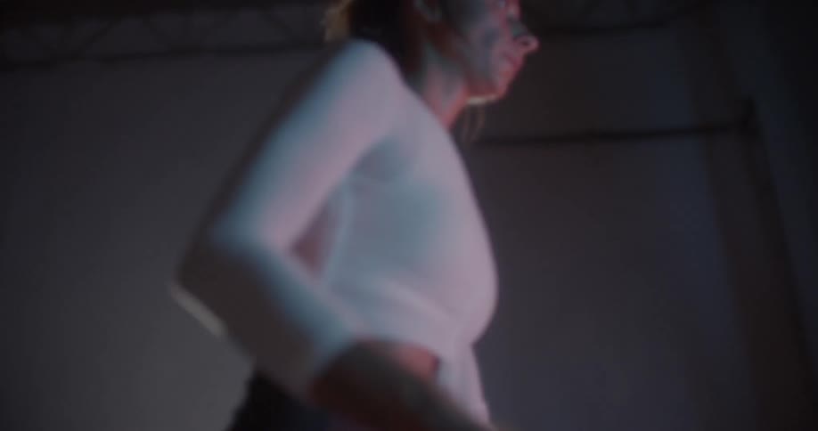 A woman exercises in a gym