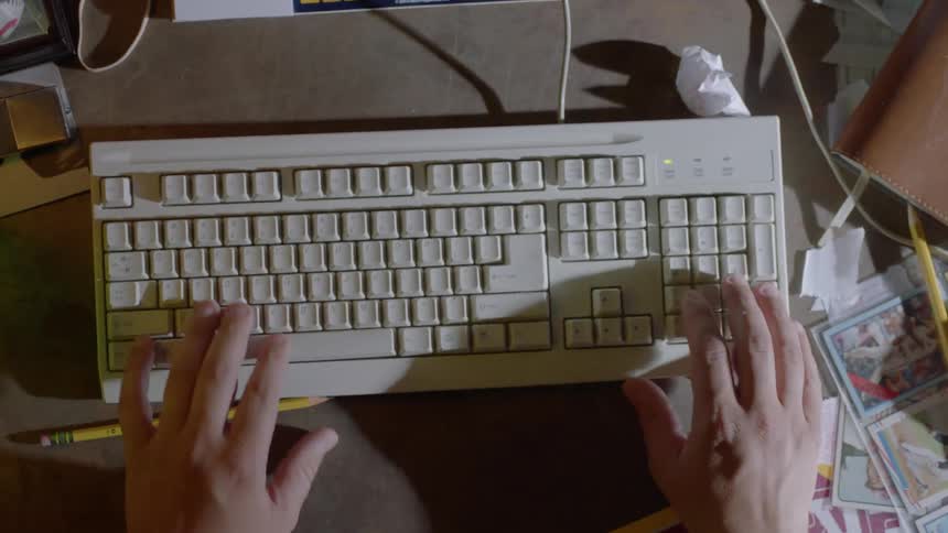 A man types on a keyboard