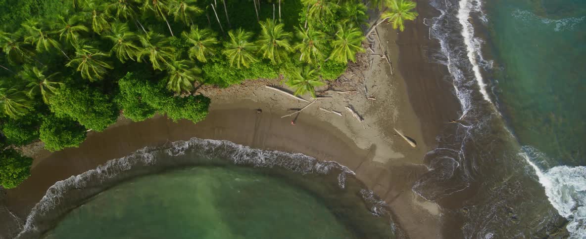 Ocean waves wash ashore a sandy beach