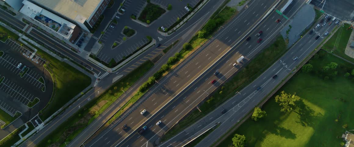 Cars drive on a city street