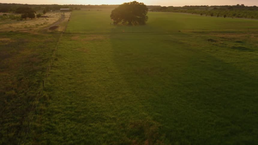 Aerial view of some farmland at sunset