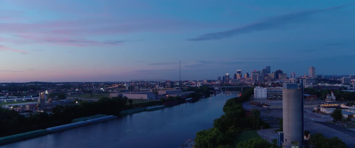 A river through a city at sunrise