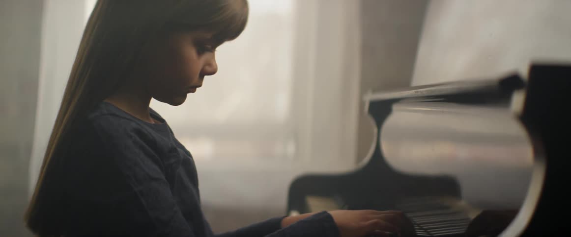 A child is playing the piano