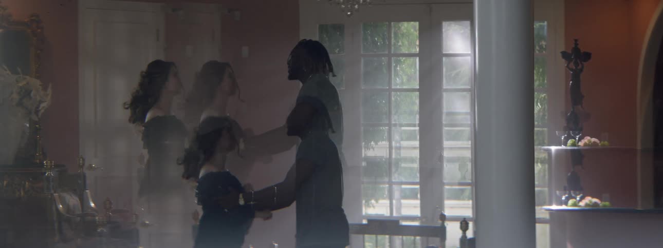 A man and woman are fighting with each other in the living room of a house