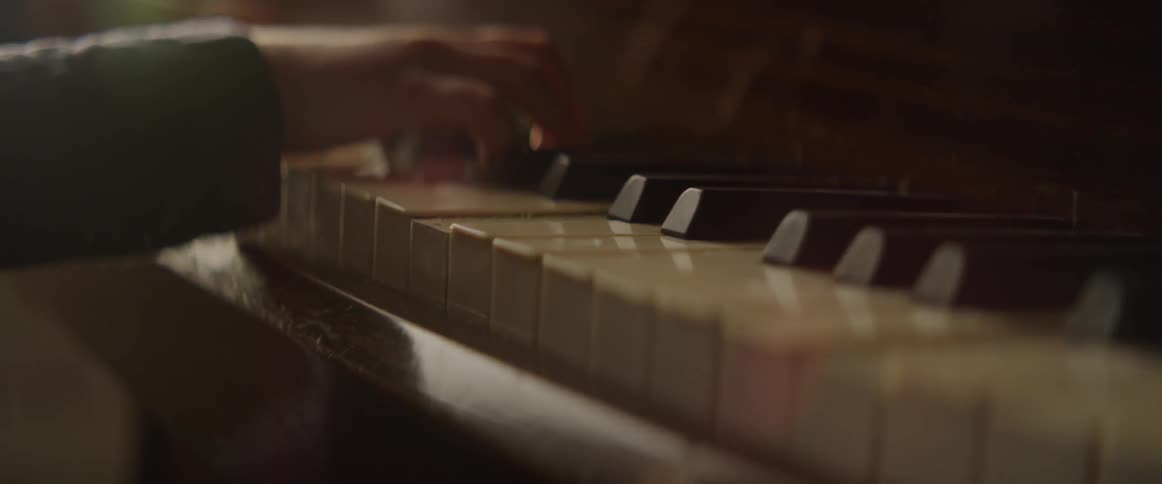 A pianist plays the piano