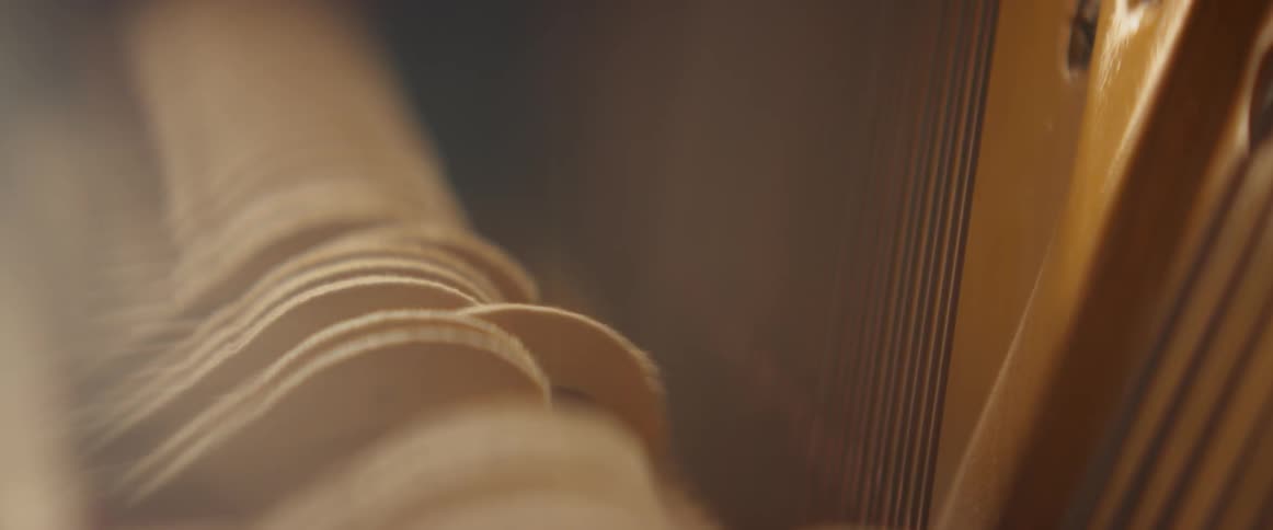Inside a piano hammers strike the strings