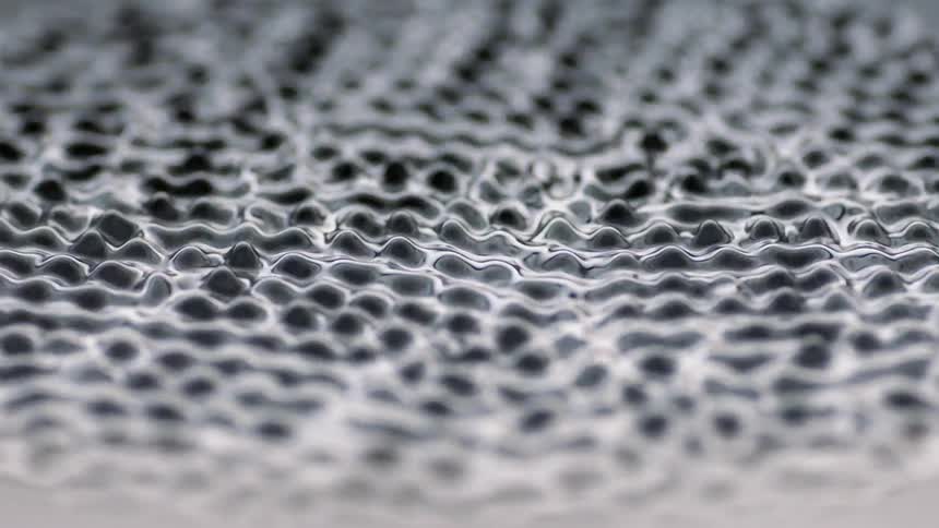 Liquid vibrates very rapidly in a spiked pattern