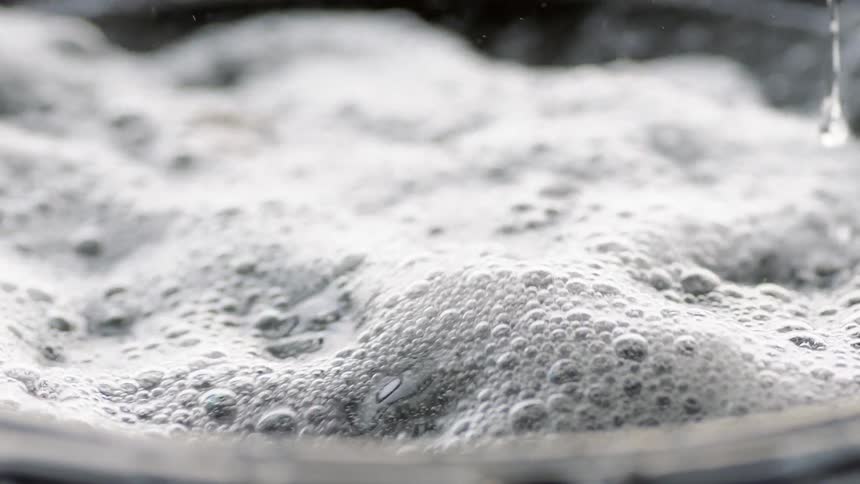 Water vibrates violently and bubbles