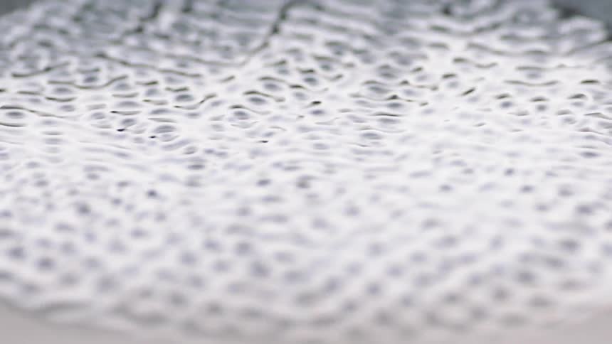 Water vibrates rapidly in a spherical pattern