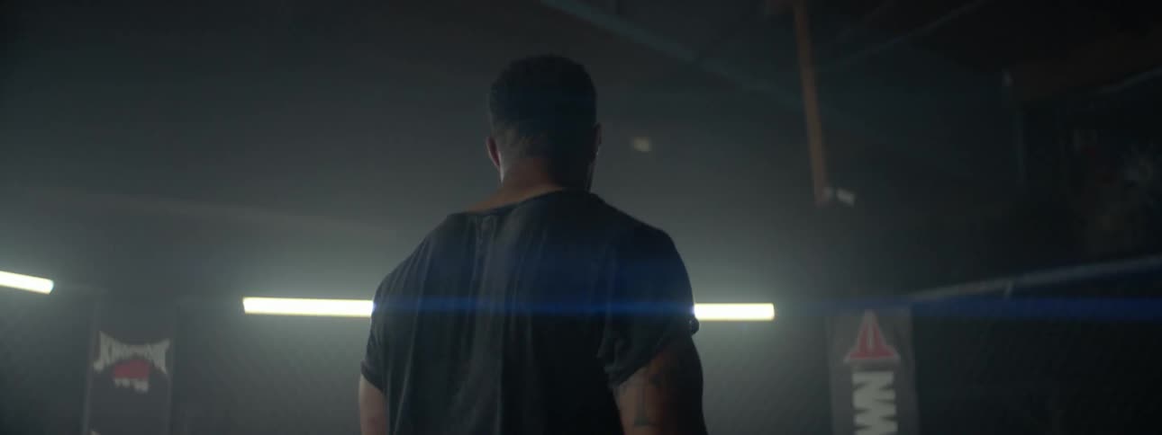 A man jogs in place inside a gym