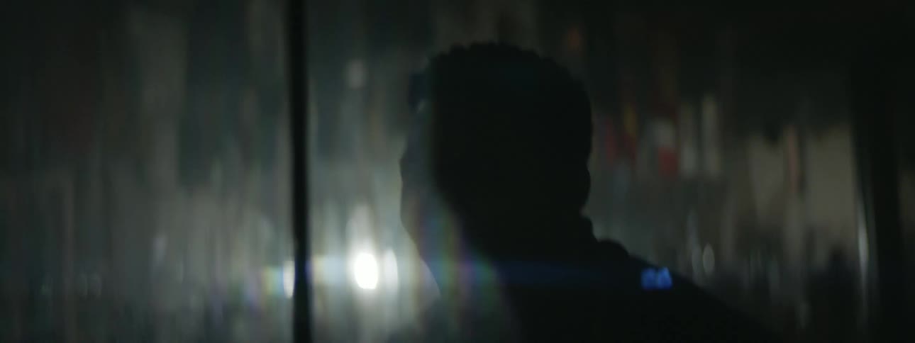 A man screams while looking in a mirror