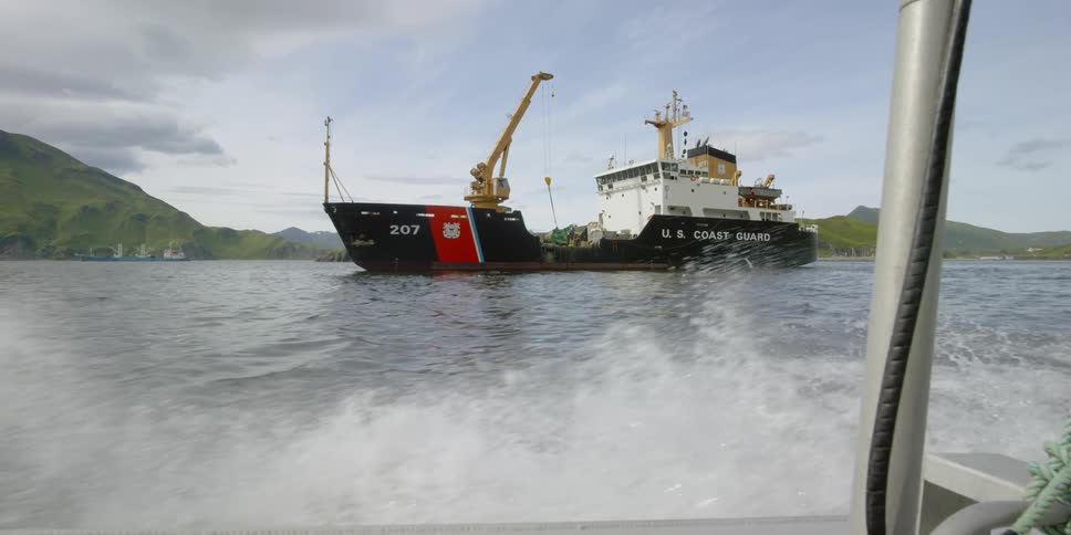Ship heads to port with water splashing around