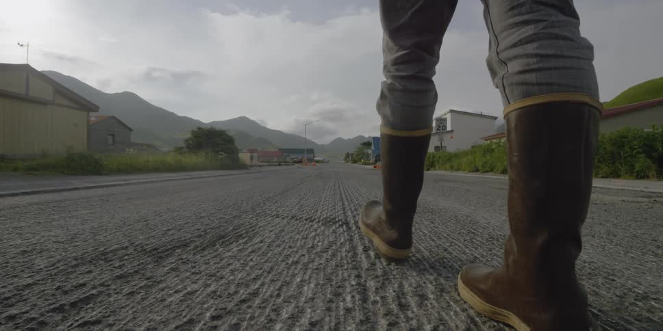 A bumpy road is running through a small neighborhood