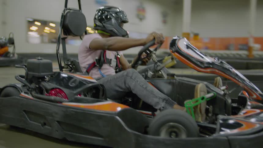 A person is riding a go kart