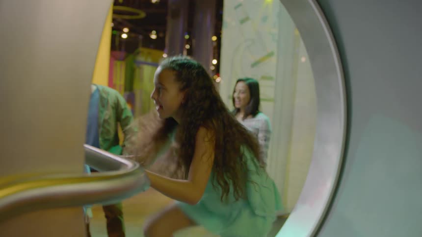 Girl plays on a museum exhibit
