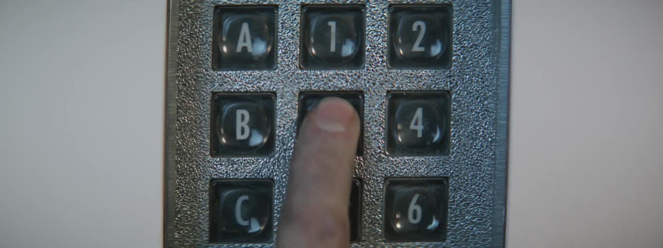A person presses buttons on a machine