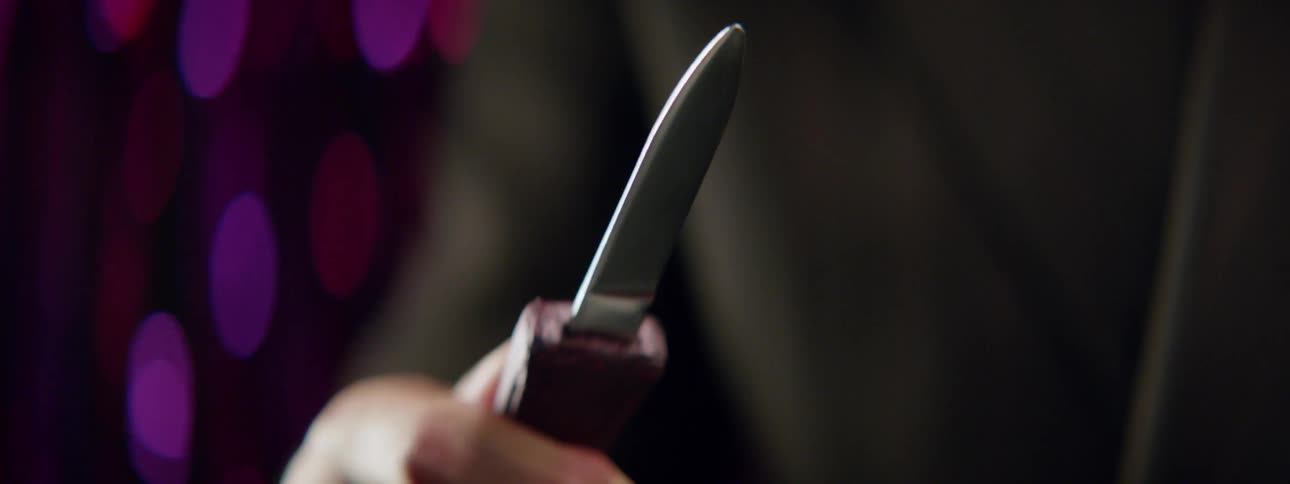 A person pops the blade from a knife