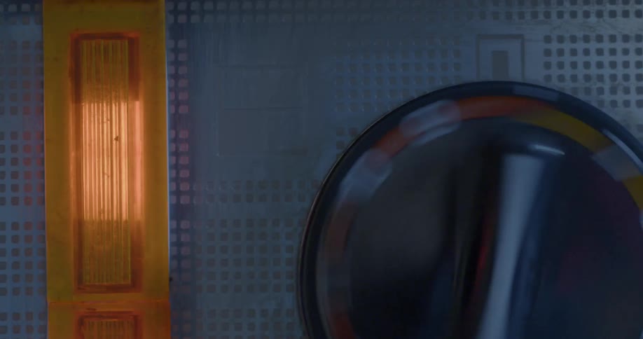 A person is turning a dial on an instrument panel from 0 to 10
