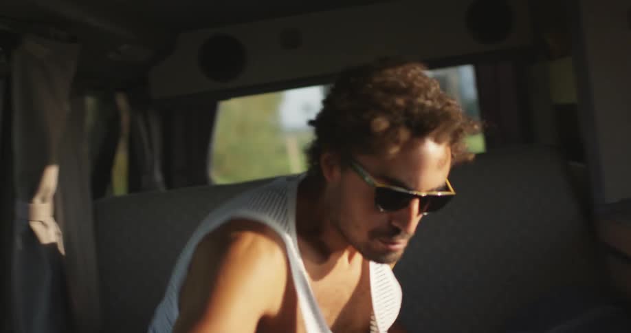 Man runs alongside moving car and jumps inside