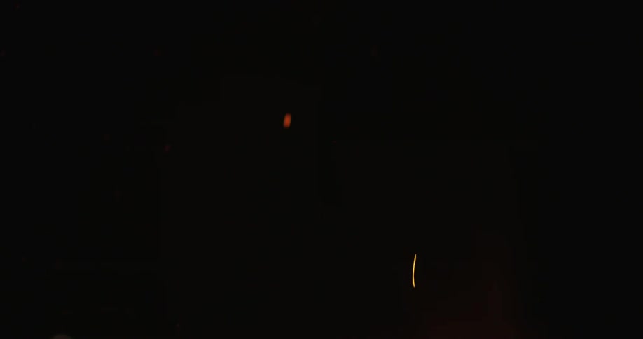Orange sparks flying in the dark