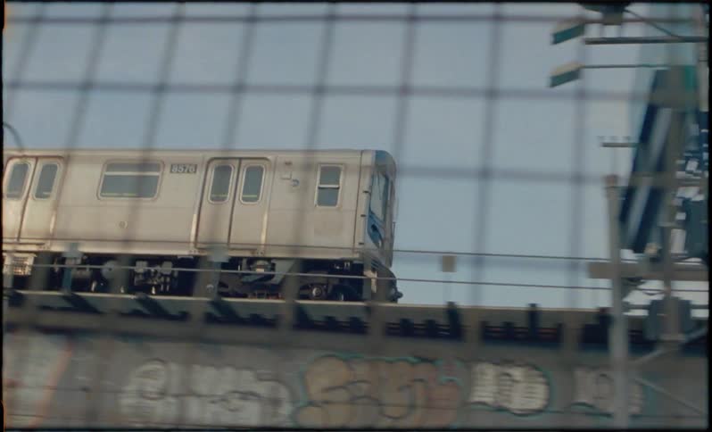 A train drives through an urban area