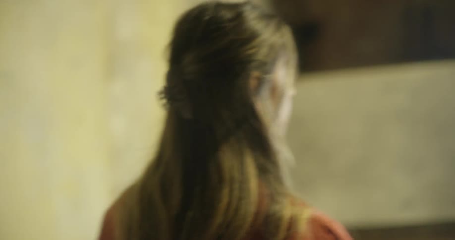 A woman walks inside a building