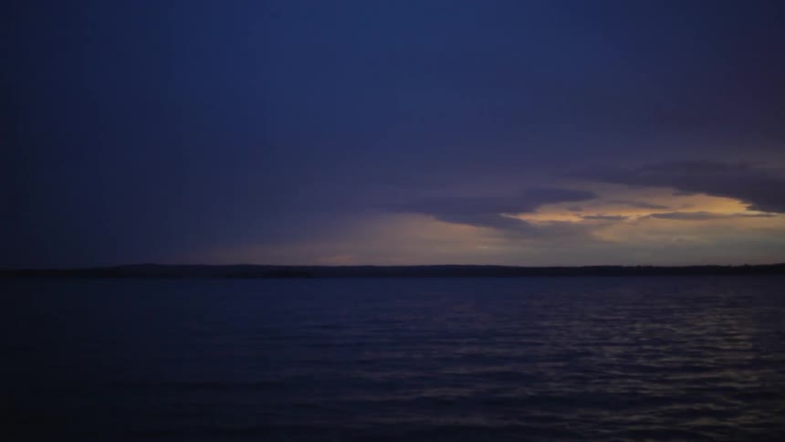 Water ripples on a lake at dusk