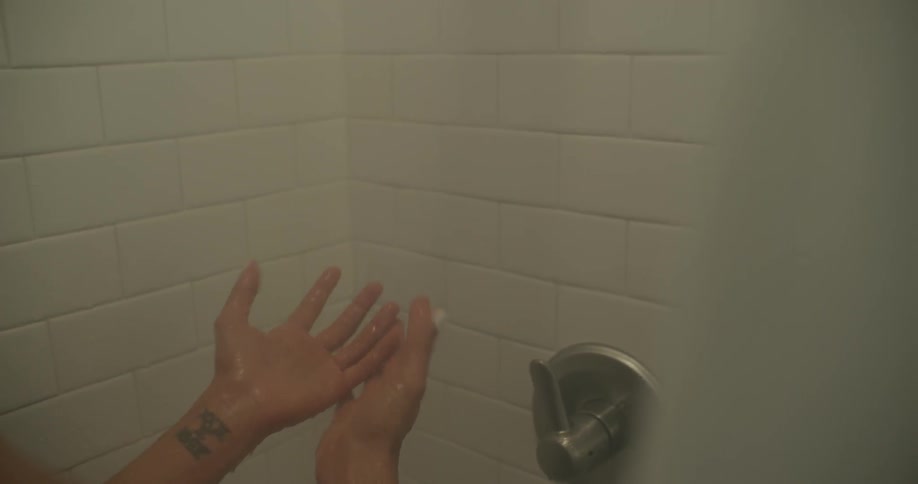 Woman takes a steamy shower