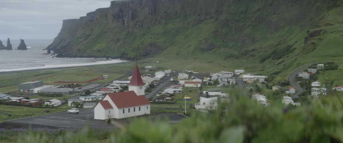 A small community sits on an ocean coast