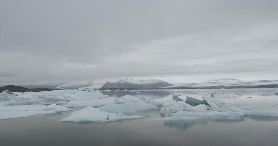 Chunks of ice float on a mountain lake