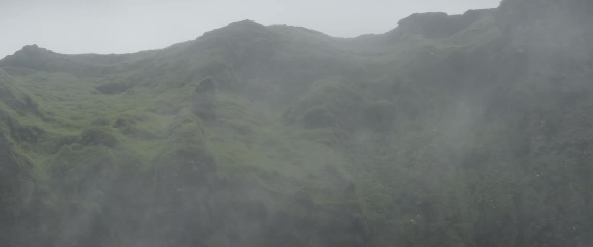 Mist floats in mountain air