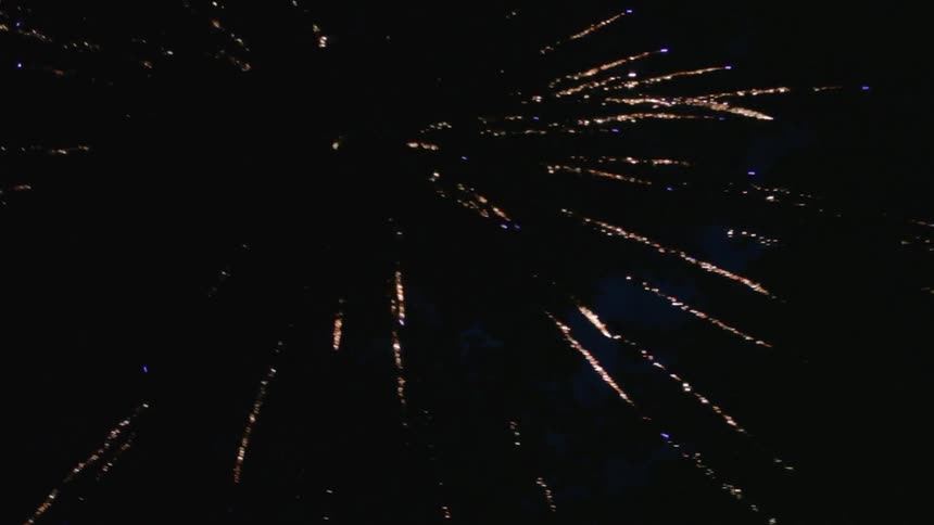 A firework is exploding in the night sky