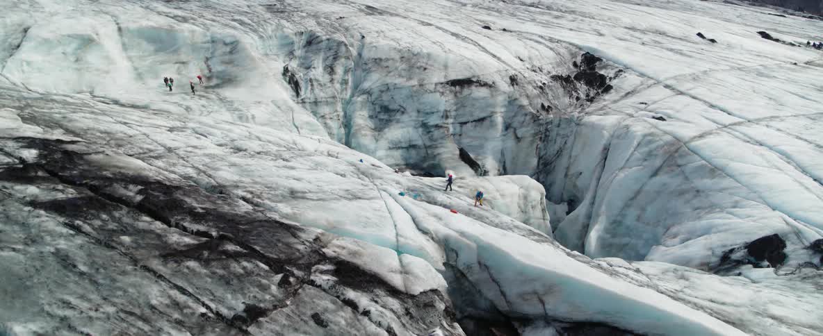 People  standing on a glacier