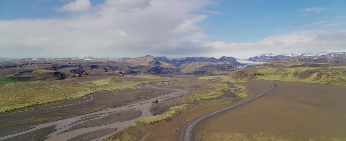 A road near a shallow riverbed