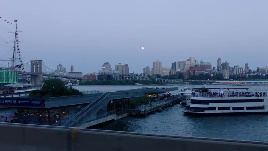 Boats float on a city river