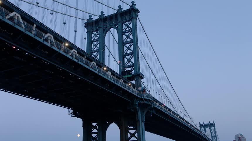 Bridge spanning a river near a large city