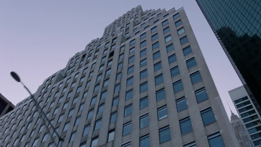 Tall city buildings tower into the sky