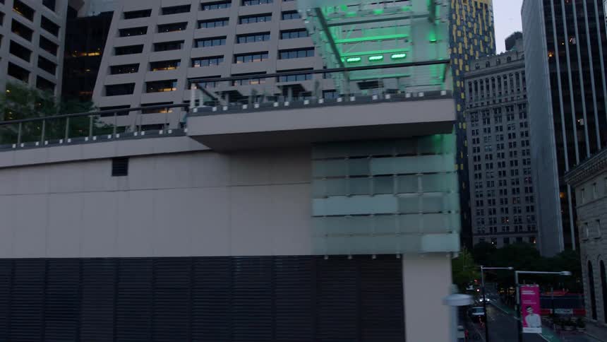 A large city is viewed from the street