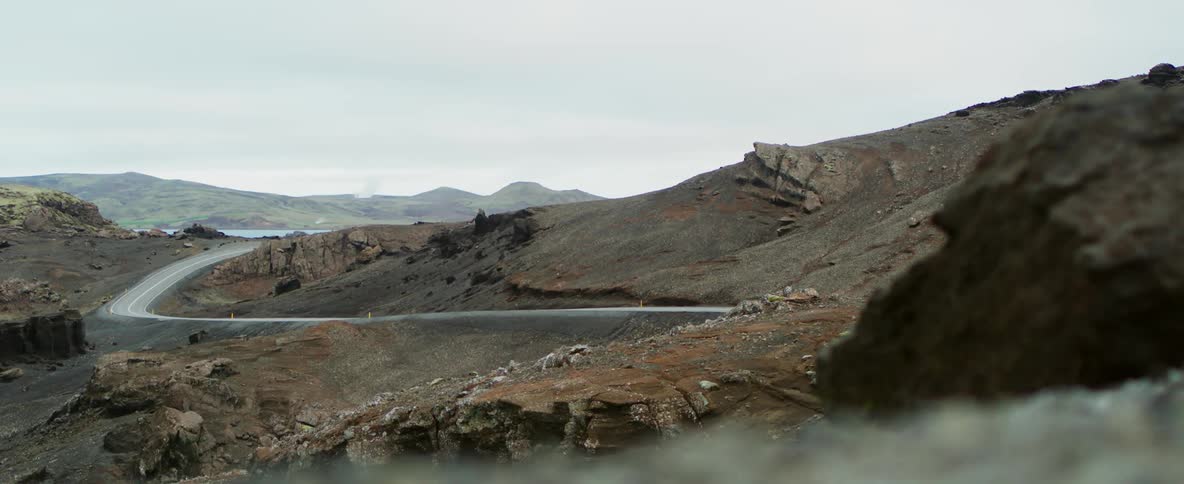 A road winds down a mountainside