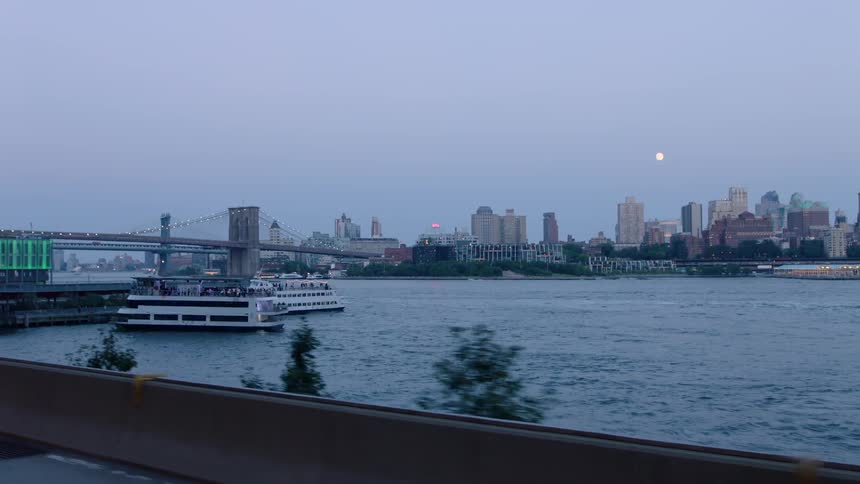 Boats float on the water by the city