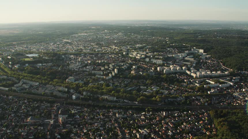 A large city surrounded by trees