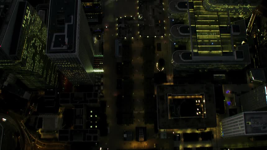 City buildings illuminate the night