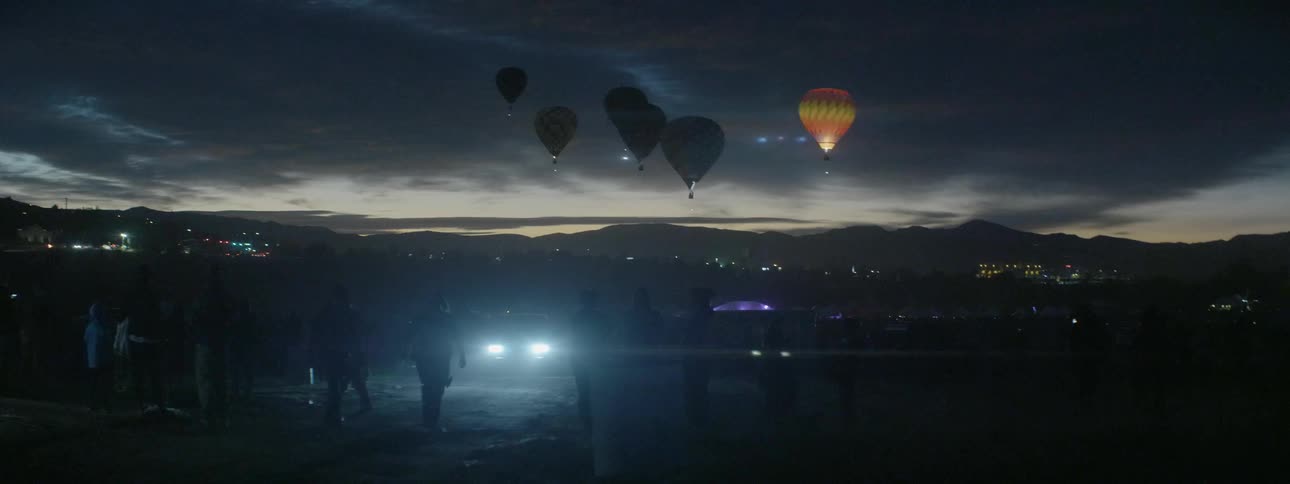 Hot air balloons in the night sky