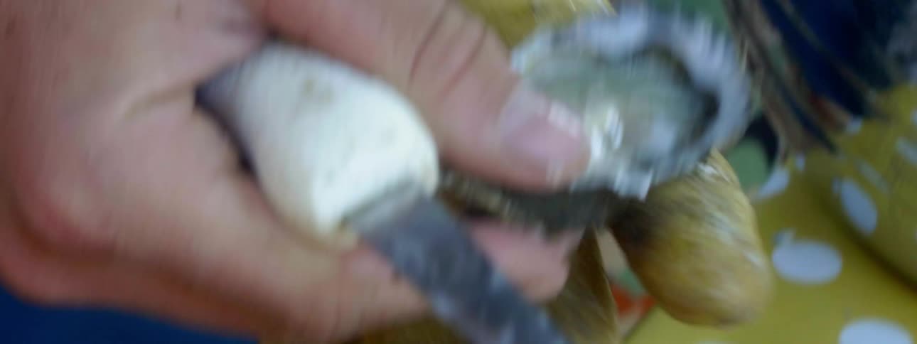 A man opens an oyster shell