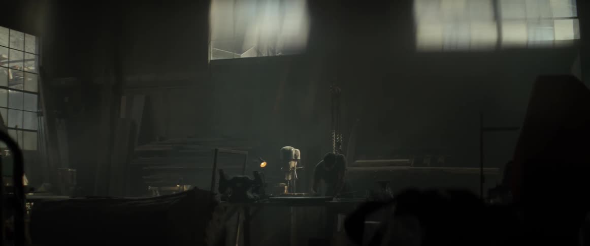 A man walks around a workshop